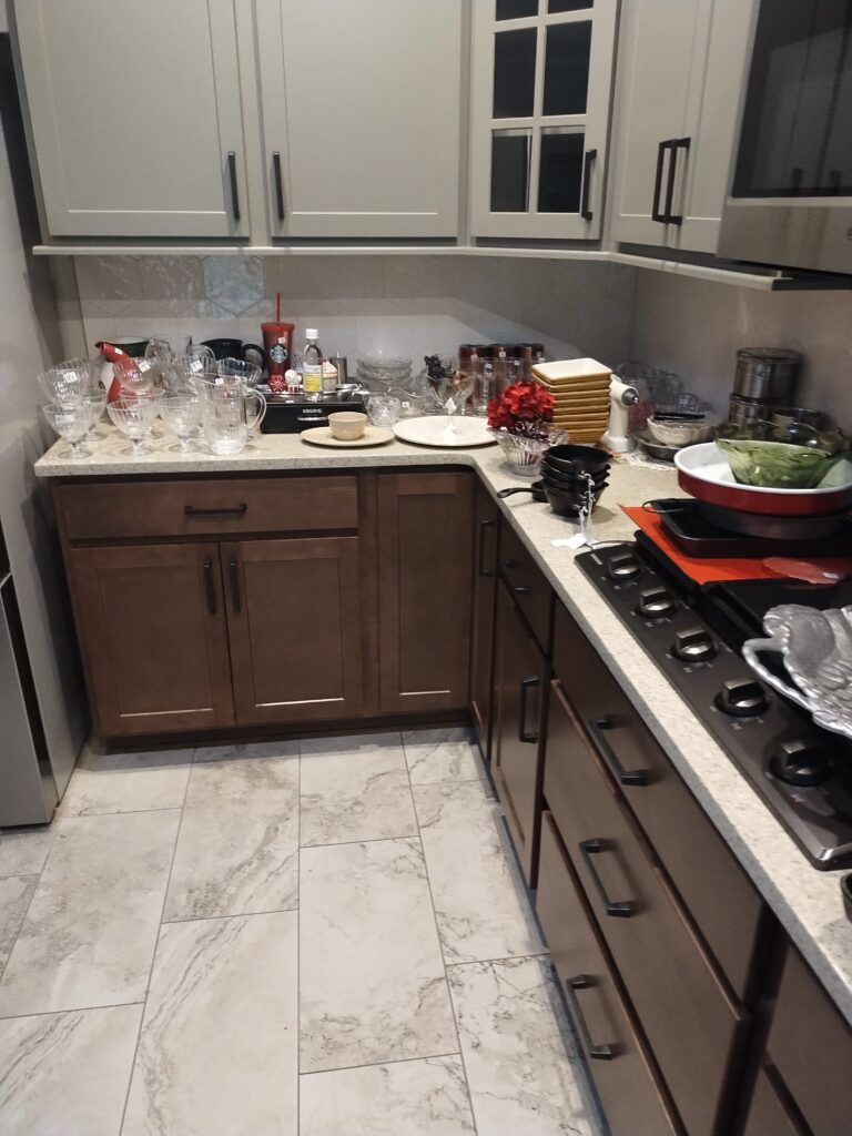Kitchen glassware and utensils left after estate sale awaiting removal in Sugarmill Woods Florida